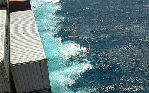 The upturned hull is seen from the Maersk Kure which stood by the Cheeki Rafiki for a time before being stood down by the US Coast guard. The yacht has only just been relocated by the US Navy. © SW