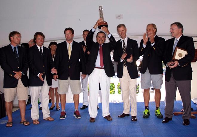 George Sakellaris, the owner of Shockwave holds up the Gibbs Hill  Lighthouse trophy.   © Barry Pickthall / PPL