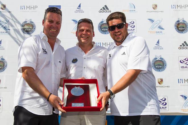 2014 Match Race Germany - James Pleasance (centre) presenting commemorative Garrard plaque to the organisers, Eberhard Magg and Harald Thierer. ©  Ian Roman / WMRT