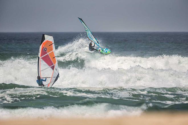 Kai Katchadourian airs over a section as Josh Stone heads out. © American Windsurfing Tour http://americanwindsurfingtour.com/