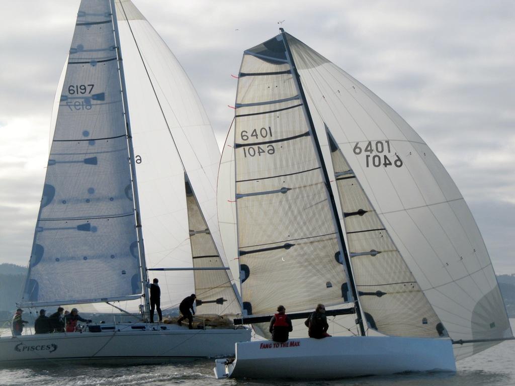 Sports boat Fang to the Max, winner of today's Division 1 of the Derwent Sailing Squadron Winter Series, paces it out with offshore racer, Pisces.   -  Derwent Sailing Squadron Winter Series 2014 photo copyright Michelle Edwards taken at  and featuring the  class