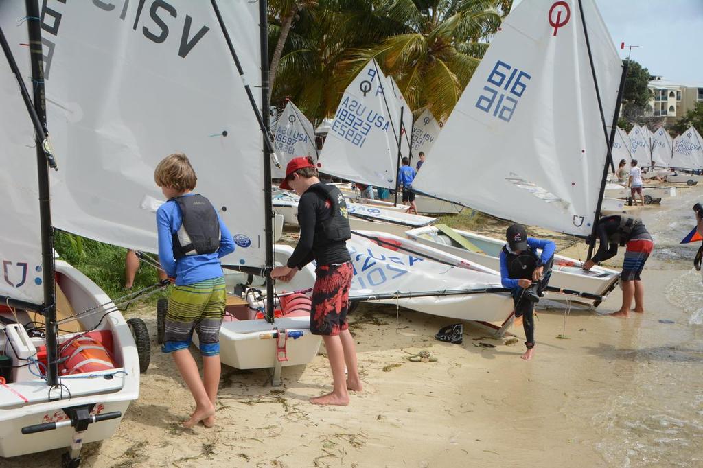 Optimist sailors line up on the St. Thomas Yacht Club beach ready to launch. © Dean Barnes