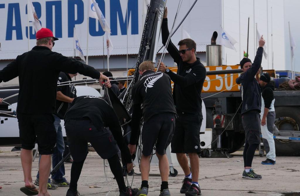Emirates Team New Zealand crew  rig the boat prior to it going in the water in St Petersburg, Russia © Hamish Hooper/Emirates Team NZ http://www.etnzblog.com
