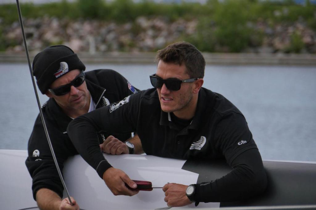Blair Tuke rigs the boat prior to it going in the water in St Petersburg, Russia © Hamish Hooper/Emirates Team NZ http://www.etnzblog.com