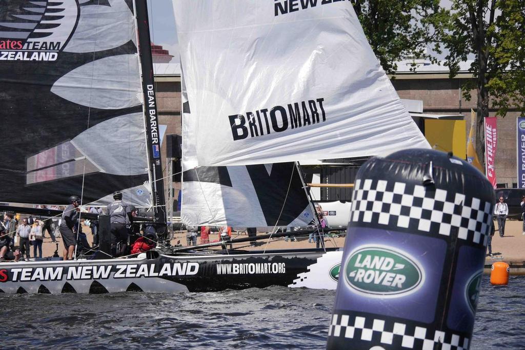 Emirates Team New Zealand crosses the finish line during racing on day 3 of Act 4 of the Extreme Sailing Series in St Petersburg, Russia © Hamish Hooper/Emirates Team NZ http://www.etnzblog.com