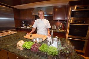 Chef Esther Rupenovic in the galley of the 151-foot motor yacht Katya where she prepared her winning ``Best Charter Yacht`` dish of smoked mussels and clams, pickled beets, horseradish and soba noodles during the 2014 Newport Charter Yacht Show photo copyright Billy Black http://www.BillyBlack.com taken at  and featuring the  class