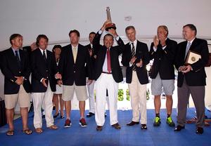 George Sakellaris, the owner of Shockwave holds up the Gibbs Hill  Lighthouse trophy. photo copyright Barry Pickthall / PPL taken at  and featuring the  class