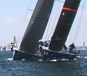 Bob Lane's Medicine Man (l.) and Victor Wild's Bud duel for room the pin end of the start line photo copyright Rich Roberts taken at  and featuring the  class