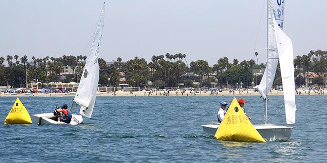 Snipes round opposite ends of leeward gate as others enjoy a big day on the beach   © Rich Roberts http://www.UnderTheSunPhotos.com