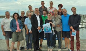From left to right : Alain Sabouraud (General Secretary, SNSQP), Géraldine Le Parc (Crêperie du Port), Serge Lacroix (Director of the Tourism Office of Saint-Quay-Portrieux), Jacques Burlot (Race Committee, SNSQP), Karine Georgel (Illustrator), Thierry Simelière (Mayor of Saint-Quay-Portrieux), Baptiste (Restaurant La Passerelle), Jonathan Touyer (SNSQP), Sophie Millon (Restaurant Le Victoria), Lucie Lemarchand (Restaurant l'Atypic), Erwan Barbey-Chariou (Deputy Mayor of Saint-Quay-Portrieux), Marie-Thérèse Bertheriaux (Restaurant La Passerelle), Jean-Michel Gaigné (Director of Port d'Armor), François Coudray (Directeur of SNSQP). - Half Ton Classics Cup photo copyright Half Ton Classics Class taken at  and featuring the  class