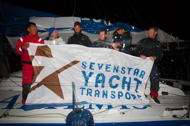 Brian Thompson and crew of IMOCA 60, Artemis-Team Endeavour celebrate after completing the RORC's Sevenstar Round Britain and Ireland Race - (from left: Kit Cheng, Meirion Stenner, Ollie Young, Mikey Ferguson, Pete Cumming) - Sevenstar Round Britain and Ireland Race 2014 © Patrick Eden/RORC