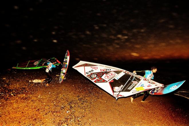 The final dash in the dark; Thomas Traversa and Victor Fernandez-Lopez head to the water in the 2014 KIA Cold Hawaii PWA World Cup. © Cold Hawaii World Cup