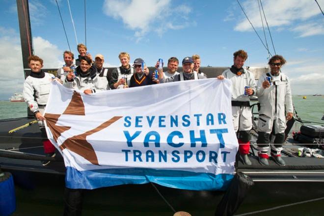 Celebrations for Varuna on the dock after crossing the finish of the Sevenstar Round Britain and Ireland Race 2014 © Patrick Eden/RORC