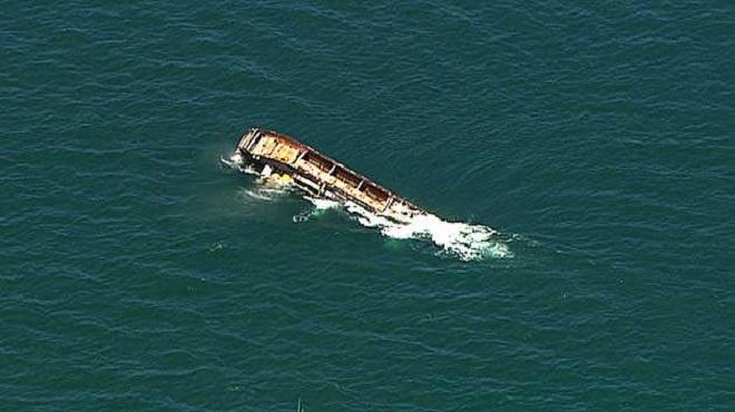 Aerial shot of the barge being scuttled. © 7News Brisbane
