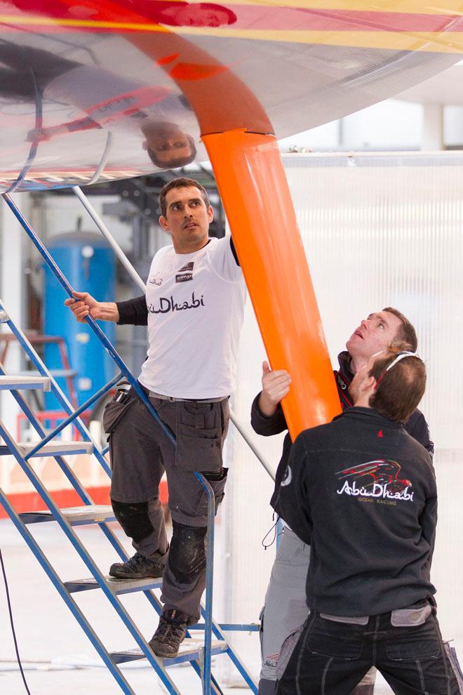 24th February 2014. ENGLAND, Hythe, Green Marine. Tom Bushell and Ben Davis fit one of Abu Dhabi Ocean Racing's rudders. ©  Ian Roman / Abu Dhabi Ocean Racing