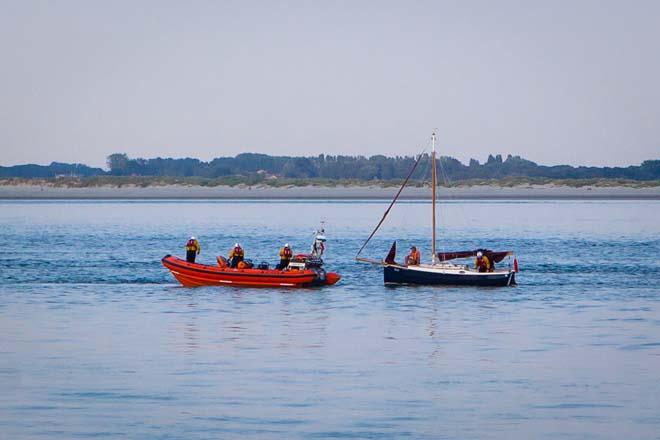 Moth yacht being towed in by RNLI © Tom Gruitt / yachtsandyachting.com