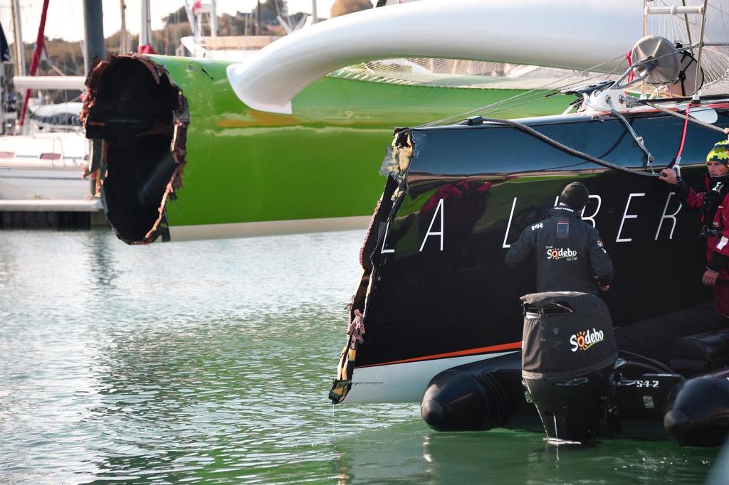French skipper Thomas Coville's damaged Class Ultime multihull `` Sodebo Ultim' `` is pictured in Roscoff harbour after it hit a cargo boat during the 10th edition of the Route du Rhum sailing race in Saint-Malo, western France, on November 3, 2014. The Route du Rhum is a solo race held every four years between Saint-Malo to Pointe-a-Pitre, in the French West Indies. AFP PHOTO / DAMIEN MEYER photo copyright @ AFP taken at  and featuring the  class