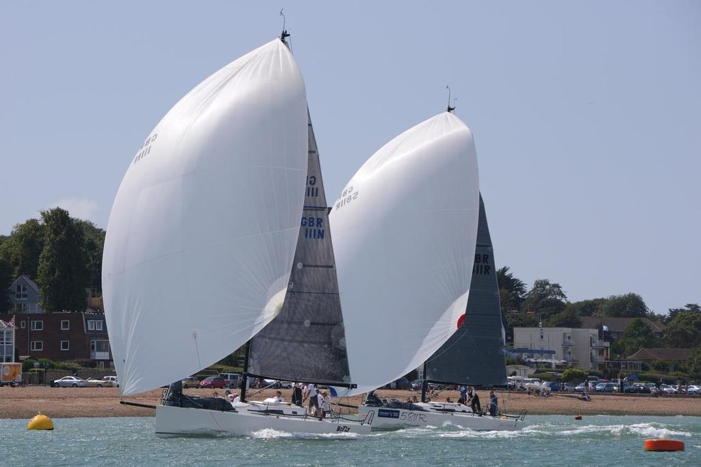J/111s flying down the Solent off Cowes photo copyright Tim Wright taken at  and featuring the  class