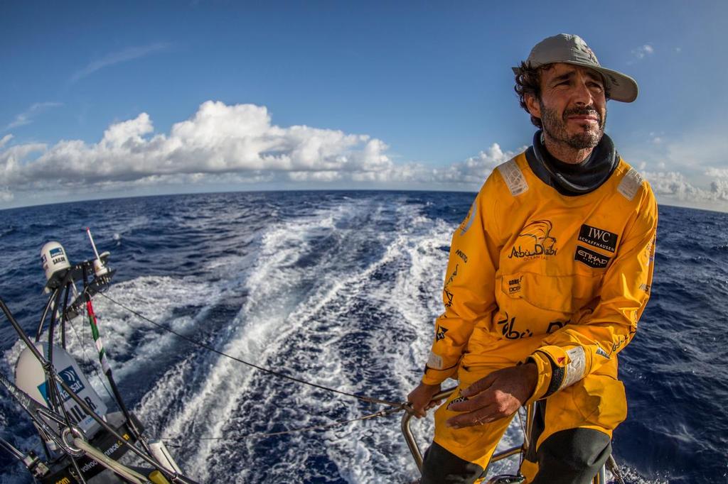 October 26, 2014.Leg 1 onboard Abu Dhabi Ocean Racing. Roberto Bermudez de Castro, aka Chuny, surveys the horizon from the stern of ``Azzam``. photo copyright Matt Knighton/Abu Dhabi Ocean Racing taken at  and featuring the  class