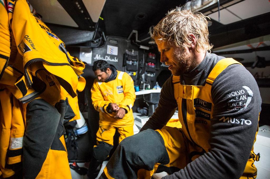October, 2014. Leg 1 onboard Abu Dhabi Ocean Racing. Luke Parkinson and Adil Khalid, getting dry off watch, © Matt Knighton/Abu Dhabi Ocean Racing