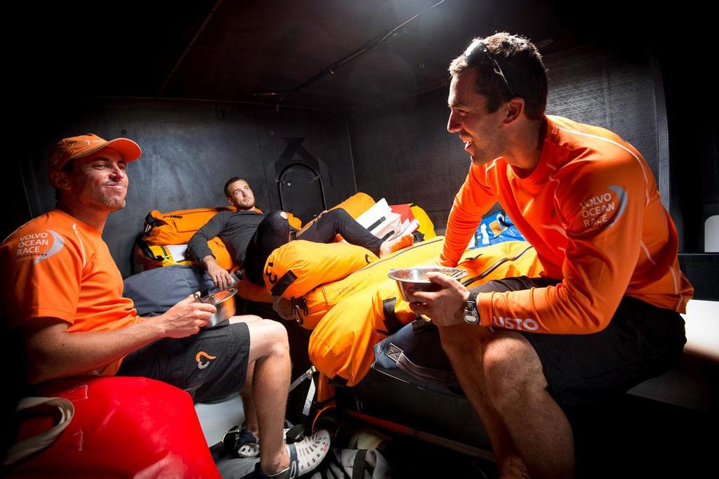 2014-15 Volvo Ocean Race - October 16, 2014. Leg 1 onboard Team Alvimedica. Day 5. Through the Canary Islands, the drag race continues along the coast of the Western Sahara. Light air sailing means the mess hall moves forward to the bow, along with much of the boat's supplies and spares. Alberto Bolzan (L), Nick Dana (C), and Mark Towill (R) photo copyright  Amory Ross / Team Alvimedica taken at  and featuring the  class