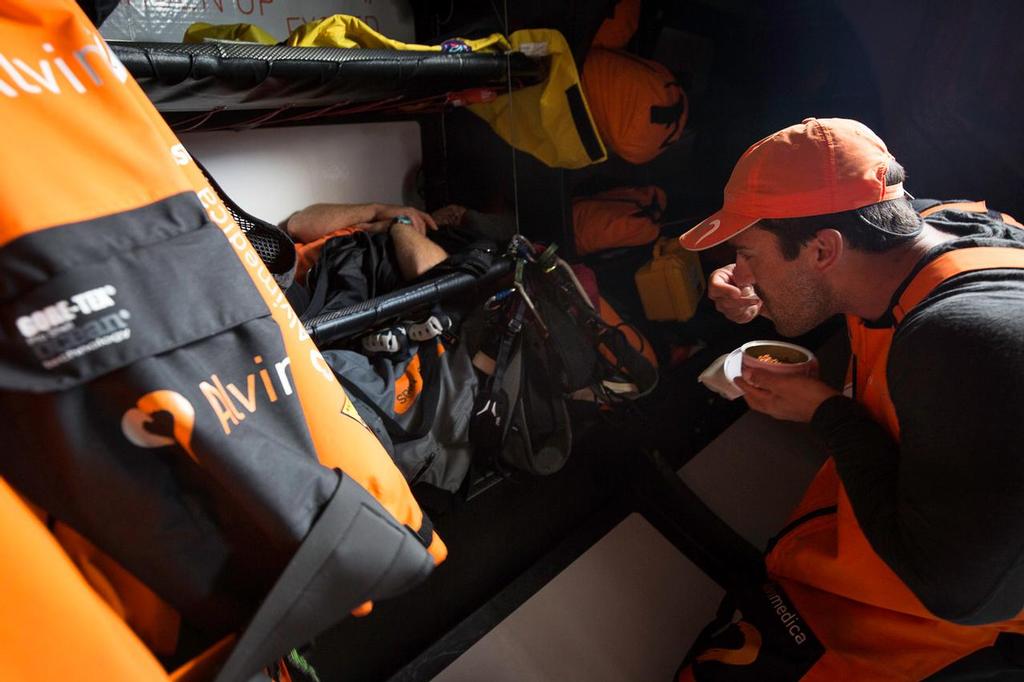 October 18, 2014. Leg 1 onboard Team Alvimedica. Day 7. The first westerly progress away from the African coast, and consequently the first day without seeing any competition. Mark Towill enjoys a fresh can of tuna in-between meals. Snacks like this are vital to keeping energy up throughout the long day. ©  Amory Ross / Team Alvimedica