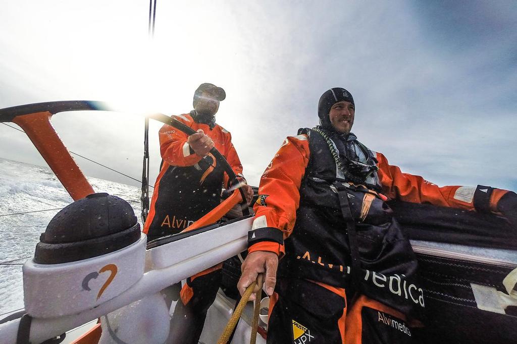 November 2, 2014.  Leg 1 onboard Team Alvimedica. Day 22. Finally the patience is rewarded with some steady wind to resume the run east to Cape Town. Charlie Enright and Nick Dana keep the pedal down on the sprint east. ©  Amory Ross / Team Alvimedica