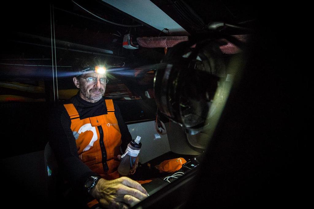 November 3, 2014. Leg 1 onboard Team Alvimedica. Day 23. After a last windy push in the morning, the winds slowly drop as the final stage of Leg 1 begins: navigating a tricky maze of high-pressure that blankets much of the last 1,000 miles to the finish in Cape Town. Will Oxley crunches the latest GRIB weather files to help plot the course to Cape Town. ©  Amory Ross / Team Alvimedica