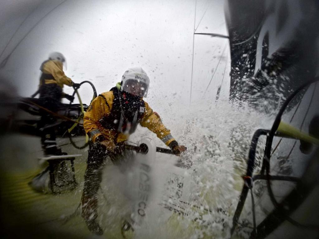 On the grinder trimming the sails after a sail change.  © Stefan Coppers/Team Brunel