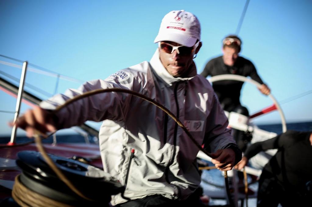 October 17, 2014. Leg 1 onboard Dongfeng Race Team. Thomas Rouxel releasing the spi during a jibe © Yann Riou / Dongfeng Race Team