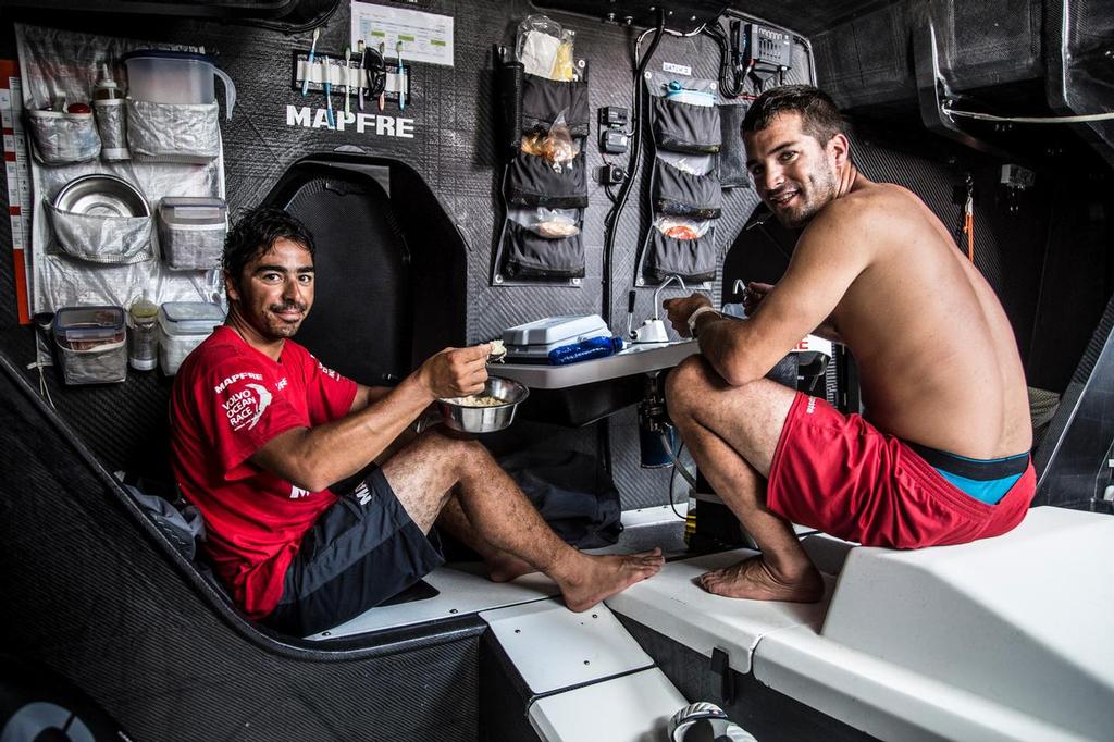 October 21, 2014. Leg 1 onboard MAPFRE. Andre Fonseca and Carlos Hernandez just woken up to have some lunch. photo copyright Francisco Vignale/Mapfre/Volvo Ocean Race taken at  and featuring the  class