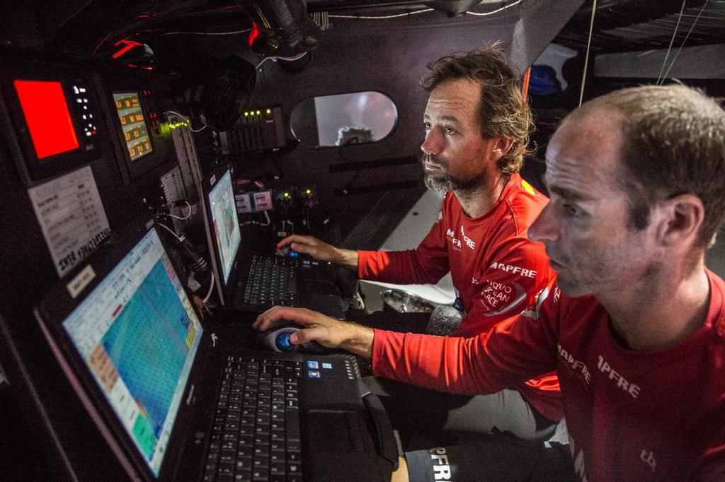 October 27, 2014. Leg 1 onboard Mapfre. Skipper, iker Martinez, and Navigator, Nicholas Lunven, at the Navigation Station discussing strategies for the coming days. photo copyright Francisco Vignale/Mapfre/Volvo Ocean Race taken at  and featuring the  class
