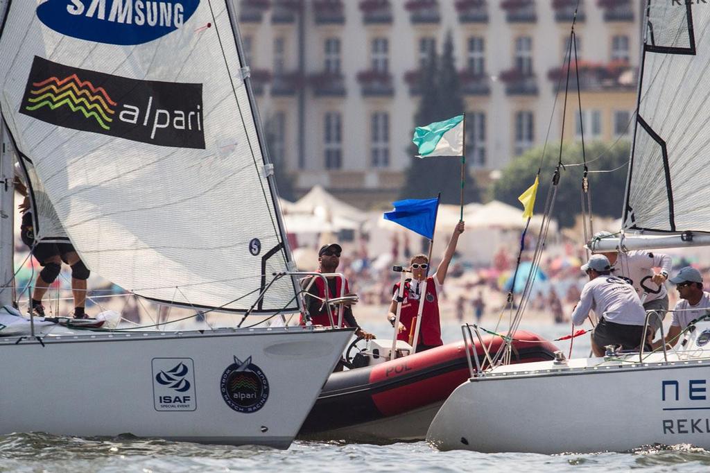 On the waters umpire making a call during final day - 2014 Sopot Match Race photo copyright  Robert Hajduk / WMRT taken at  and featuring the  class