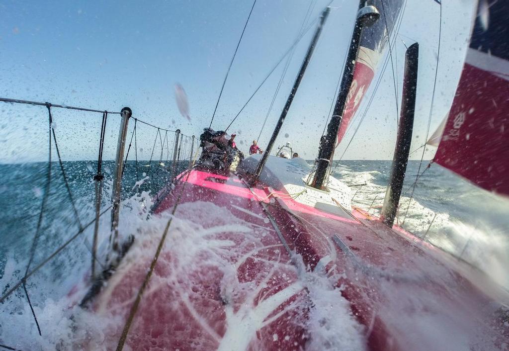 October, 2014. Leg 1 onboard Team SCA. A wave breaks over the bow as the girls begin sailing in the Trade Winds. © Corinna Halloran / Team SCA