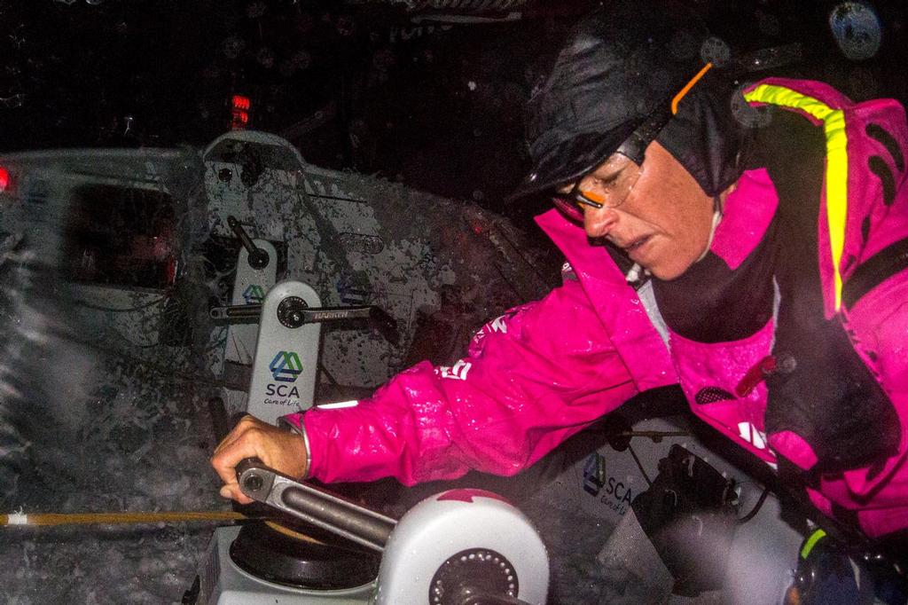 November 2, 2014. Leg 1 onboard Team SCA. Carolijn Brouwer grinds as a wave comes over the top. © Corinna Halloran / Team SCA