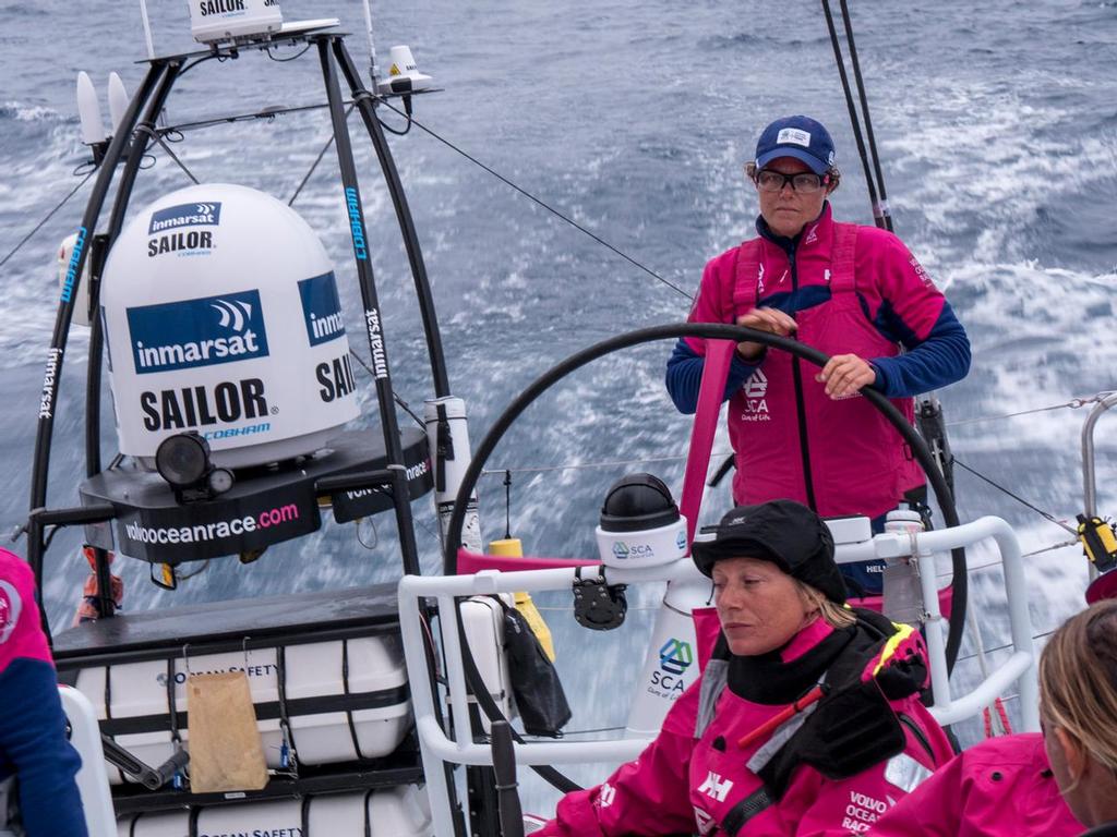 November 4, 2014. Leg 1 onboard Team SCA. Sally Barkow on the helm at dusk in the Southern Ocean. © Corinna Halloran / Team SCA
