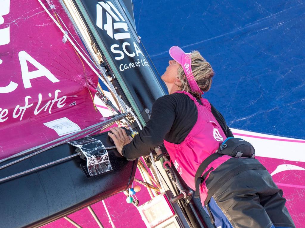 November 06, 2014. Leg 1 onboard Team SCA.  Abby Ehler checks the rig after changing sails. © Corinna Halloran / Team SCA