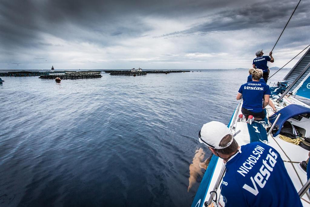 October 11, 2014. Wouter Verbraack  makes a call to sail through a fish farm. Risky? Maybe but we didn’t have to alter course and loose some valuable distance. Volvo Ocean Race.  Team Vestas Wind. Leg 1. © Brian Carlin - Team Vestas Wind