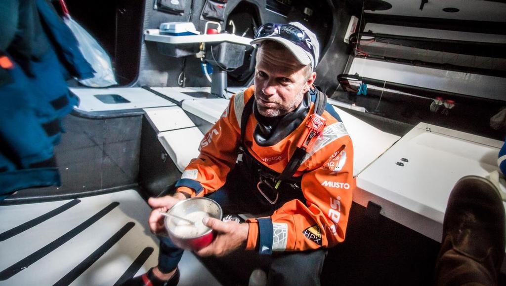 October 18, 2014. Leg 1 onboard Team Vestas Wind. Skipper Chris Nicholson takes a moment to have some breakfast. Day 7 at sea. © Brian Carlin - Team Vestas Wind