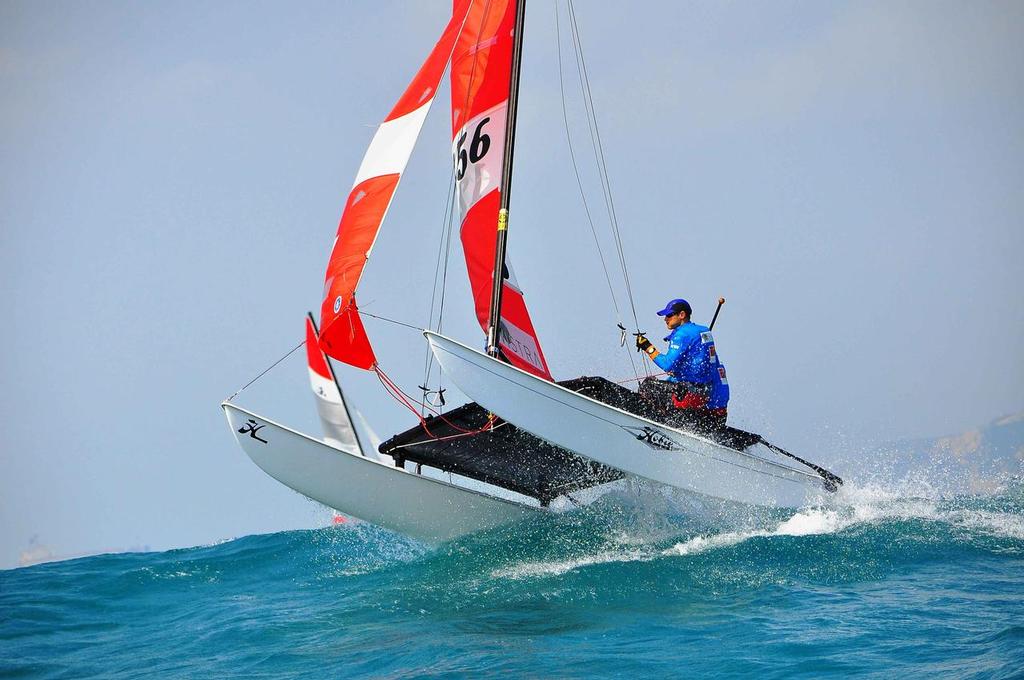 Tom Nunan and Gabriel Kicks one of the strongest local teams had to retire after a bad whipeout  (1) - VISTRA Hobie Asian Championship 2014 photo copyright Peter Kuoo taken at  and featuring the  class