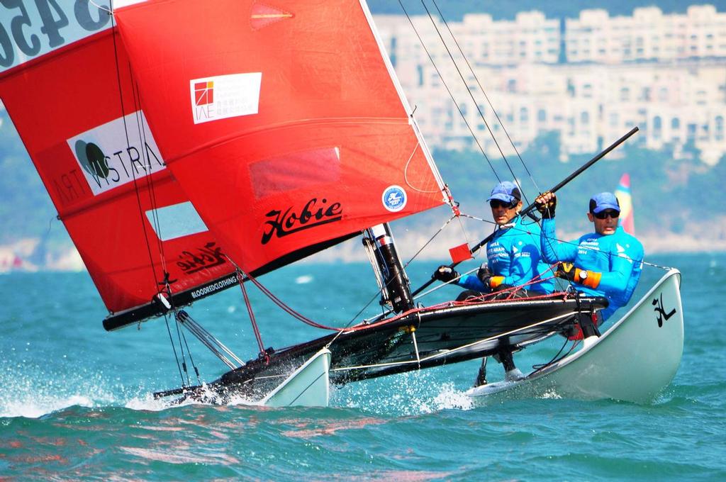 Tom Nunan and Gabriel Kicks one of the strongest local teams had to retire after a bad whipeout  (2) - VISTRA Hobie Asian Championship 2014 photo copyright Peter Kuoo taken at  and featuring the  class