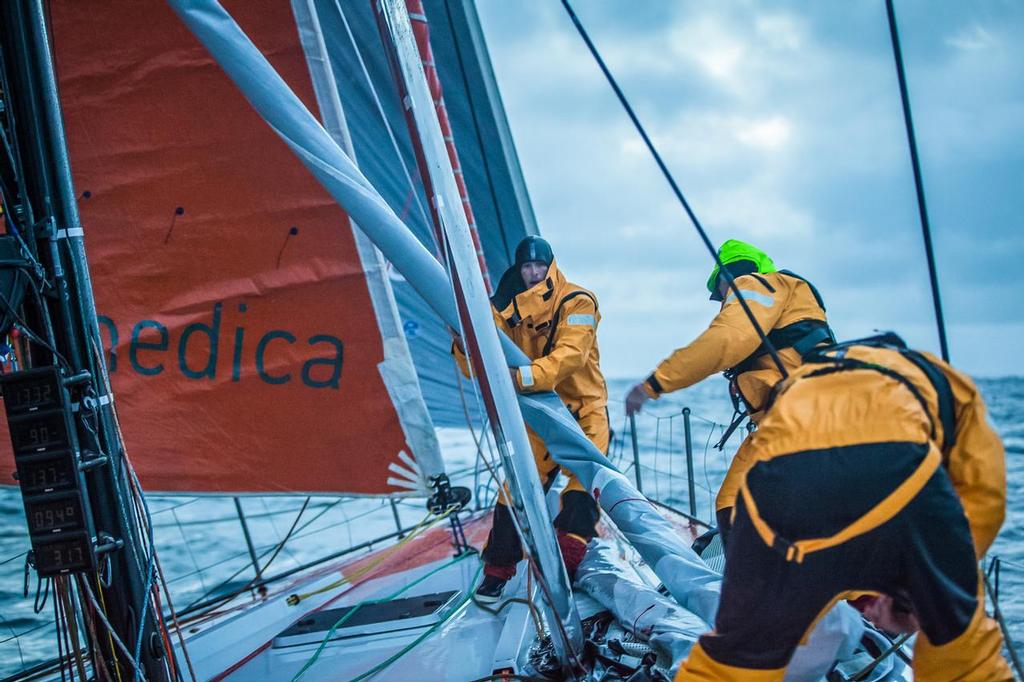 August 14, 2014. Round Britain Island Race Day 4 - OBR content Team Alvimedica: Nick Dana and Dave Swete run the bow during a frigid North Sea sail change during the RORC's Round Britain and Ireland Race. ©  Amory Ross / Team Alvimedica