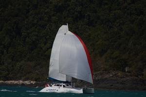 Multihull Racing Division 2 leader Rushhour enjoying another strong breeze day. - Vision Surveys Airlie Beach Race Week 2014 photo copyright Shirley Wodson taken at  and featuring the  class