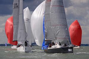J/111 fleet rounding leeward mark- first day of J/111 Worlds in the United Kingdom photo copyright  Rick Tomlinson http://www.rick-tomlinson.com taken at  and featuring the  class