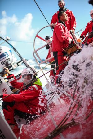 October 24, 2014. Leg 1 onboard Dongfeng Race Team. Charles Caudrelier, Jin Hao Chen and Martin Strömberg trying to keep themselves upright when the boat is heeling over and water is crashing over the deck - Volvo Ocean Race 2014-15 photo copyright Yann Riou / Dongfeng Race Team taken at  and featuring the  class