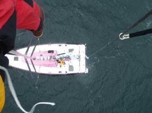 Conrad Manning attempts to fix the wind wand on top of Rare's mast  - Sevenstar Round Britain and Ireland Race 2014 photo copyright Conrad Manning taken at  and featuring the  class