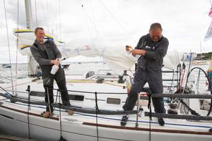 Lula Belle, Irish Two-Handed team, Liam Coyne and Brian Flahive spray their celebratory champagne  - Sevenstar Round Britain and Ireland Race 2014 photo copyright Patrick Eden/RORC taken at  and featuring the  class