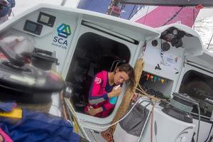 October, 2014. Leg 1 onboard Team SCA: Justine Mettraux rinses her face after her watch - Volvo Ocean Race 2014-15. photo copyright Corinna Halloran / Team SCA taken at  and featuring the  class