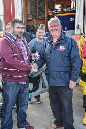 Ron Churchill junior receiving his award photo copyright RNLI / Arbroath http://rnli.org/ taken at  and featuring the  class