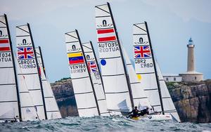 Nacra 17s ride the waves - Ciudad de Santander Trophy - 2014 ISAF Worlds Test Event Penultimate Day photo copyright Martinez Studio taken at  and featuring the  class
